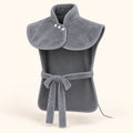 Front view of the gray Heatcape wrap: upright collar with three white snaps, open sides and a narrow front tie.